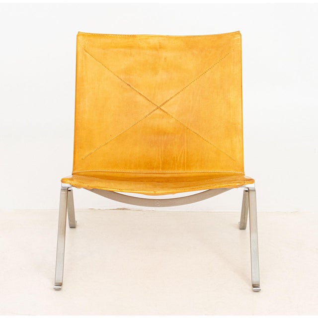 Poul Kjaerholm for Fritz Hansen "PK22" Lounge Chair, with orange leather seat and back on chrome-plate legs, "Republic of...