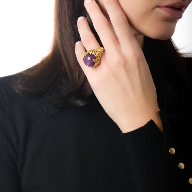 This exceptional vintage cocktail ring is a breathtaking statement of scale, color, and presence, anchored by a remarkable...