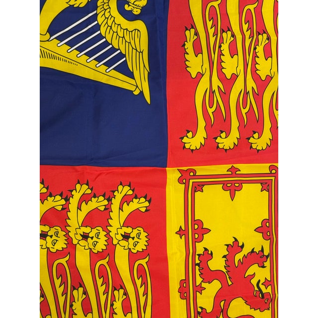 This is a late 20th century vintage Royal Standard of the United Kingdom flag. It features the coat of arms for England,...