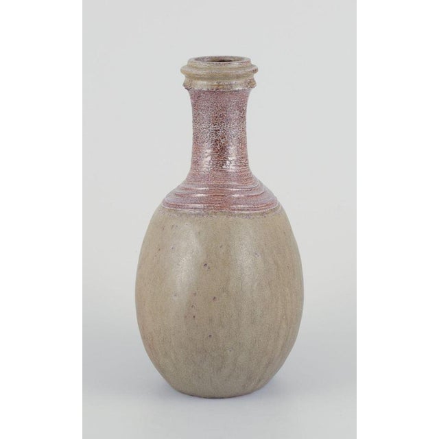 Nils Kähler (1906-1979) for Kähler. Ceramic vase in a rare shape. Olive green glaze. Circa 1970. Signed. Perfect...