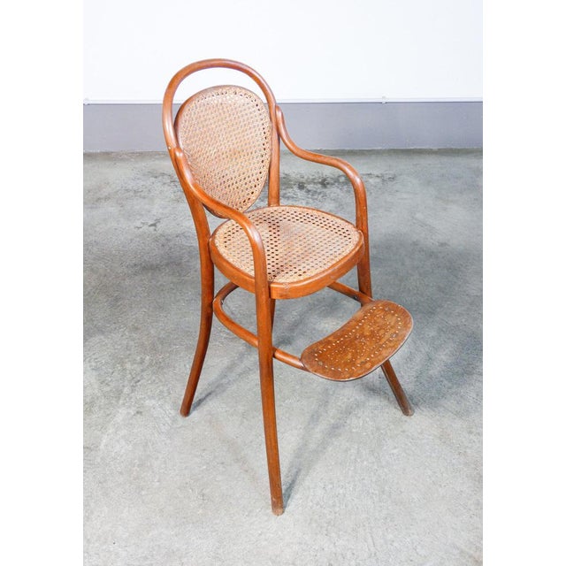 Gebrüder thonet children's high chair in bent beech wood and vienna straw. Origin austria period second nineteenth century...