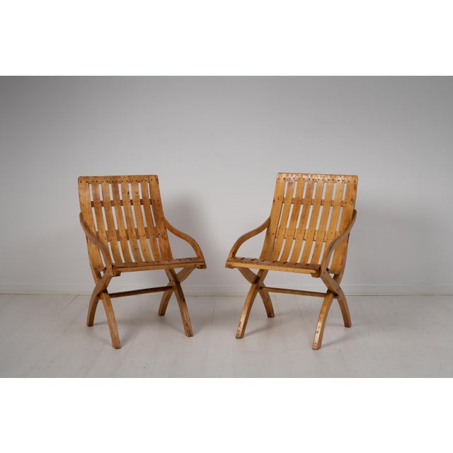 Bare wood pine and birch armchairs from the 1930s, during the Swedish Grace period. The chairs are bare wood and has the...