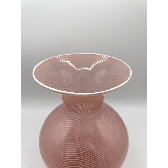 Vase from the Barovier & Toso glassworks in Murano, made of pink half-filigree with a white border. Given the signature,...
