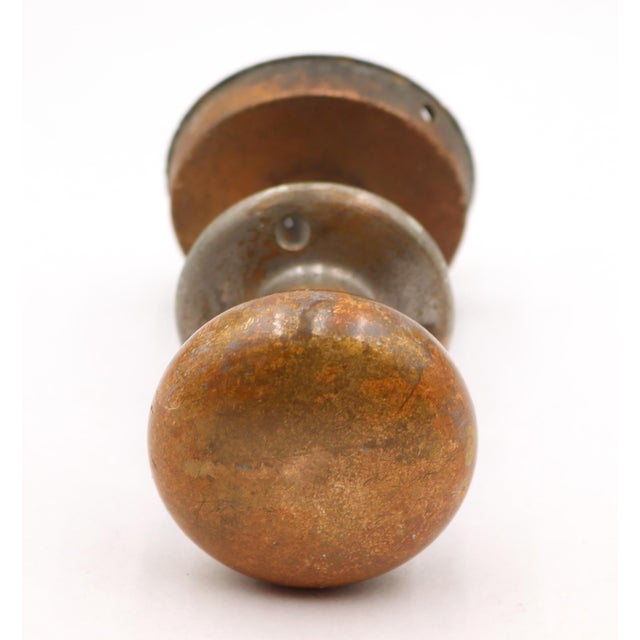 Vintage patina brass door knob set with a flush mount handle set on one side. The original mounting screws are not...