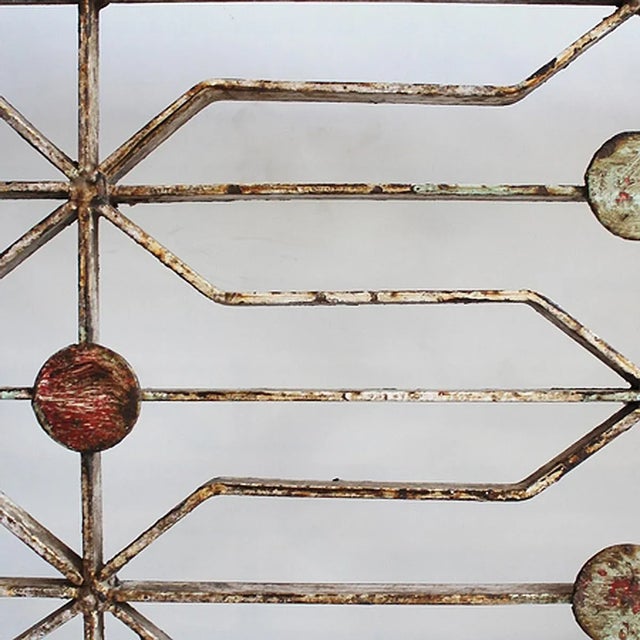 Original mid-century iron garden gate from North India. Whimsical dotted and geometric design with original painted...