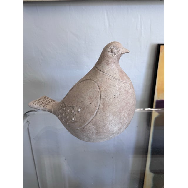 A boldly sculptural ceramic dove by Austin Productions, cast and dated 1981, with maker's stamp clearly legible on the...