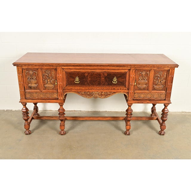 An exceptional antique English Jacobean style sideboard buffet or credenza By Batesville Cabinet Co. (early Romweber) USA,...