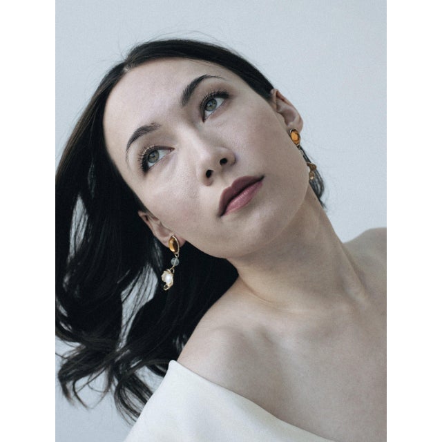 Earrings that look like they're a part of a bonbon box? With playful colors, Jade, and hand-carved flowers these floral...