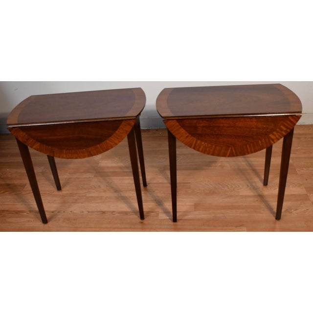 We are pleased to offer this beautiful pair of English Regency Pembroke drop-leaf Side Tables, from the 1930s. This pair...