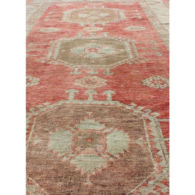 Measures: 4'5 x 7'7. Vintage Turkish Oushak Rug with Soft Coral, Pale Mint, and Warm Beige Tones. Keivan Woven Arts / rug...