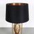 A unique brass table lamp in the style of Maison Jansen, manufactured in France around 1970. The piece has a brass...