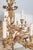 Large and highly decorative gilt metal chandelier in a French Baroque/Rococo Revival style, featuring an elaborate...