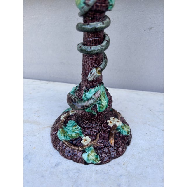 French Palissy candlestick signed Thomas Sergent, circa 1880. Trompe l'oeil wood with leaves decorated with snake and...