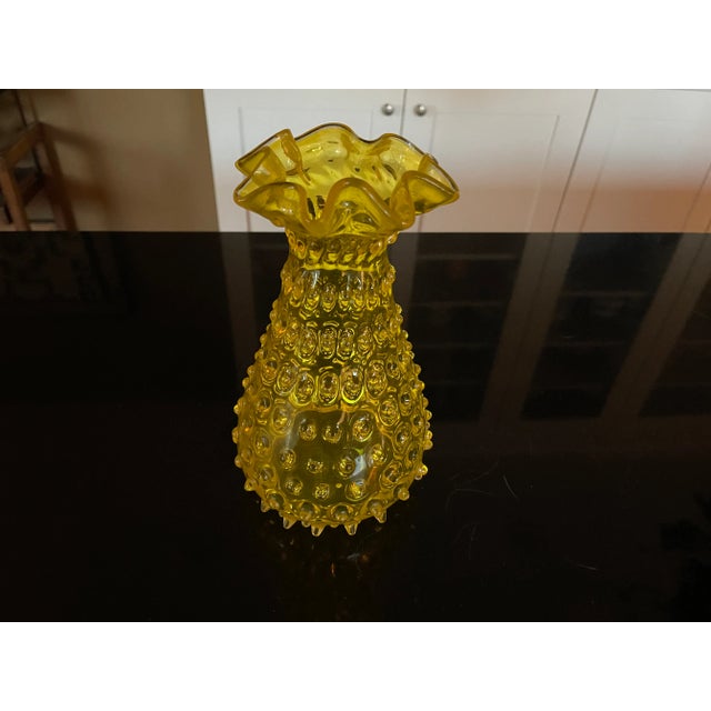 Here is a beautiful vaseline yellow glass vase with hobnail pattern and just in wonderful condition. Has a ruffled top and...