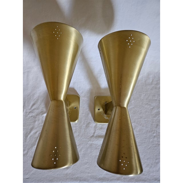 A Pair of Original MCM Spun Anodized Aluminum Electric Atomic Style Wall Sconces. Takes regular bulbs.