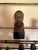 A finely hand-carved wooden bust depicting the legendary Spanish literary hero Don Quixote, produced by OURO Artesanía of...