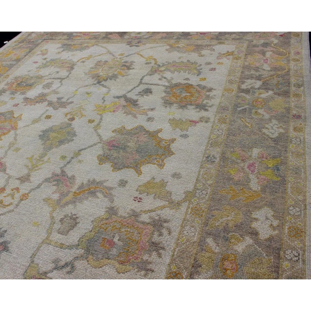 2000 - 2009 Turkish Oushak Rug With Muted Color Palette and All-Over Flower Design For Sale - Image 5 of 12