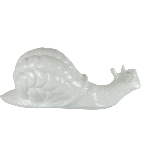 Hollywood regency style white ceramic snail, large. Made in Italy. C. 1970s Size: 19"w x 8"h x 8"d