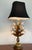 Large scale tole lamp with white metal tulips and abundant gold leaves. Included is a lovely black silk shade. This...