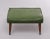 Very nice authentic foot stool. Green Faux Leather upholstery. Mahogany legs comes with Brass feet. Great looking stool....