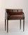 Embodying the refined classicism of the Louis XVI era, this exquisite cylinder desk commands attention with its harmonious...