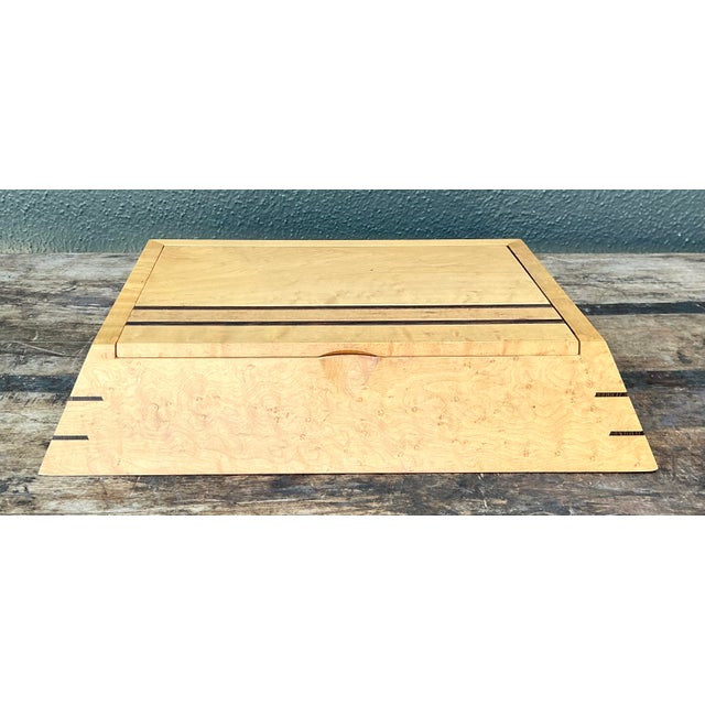 Discover the exquisite beauty of this handcrafted Modernist keepsake box, a masterclass in studio woodworking from the...