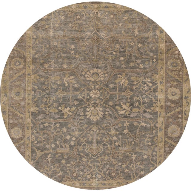 A beautiful modern Armenian rug with a tan field and blue accents with an all-over floral design. This rug measures 8' x 10'.