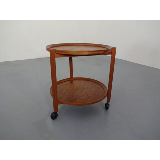 Rolling Danish tea trolley in teak. Both trays are removable. I have official proof of authenticity such as vintage...