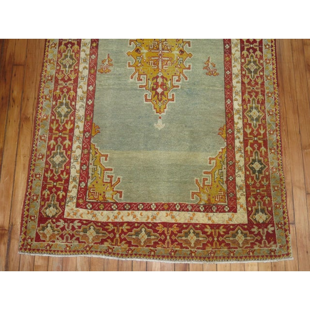 An early 20th century blue and red turkish sivas rug