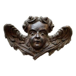 Winged Putto Sculpture with Angel Face Carved in Wood, 1700s For Sale
