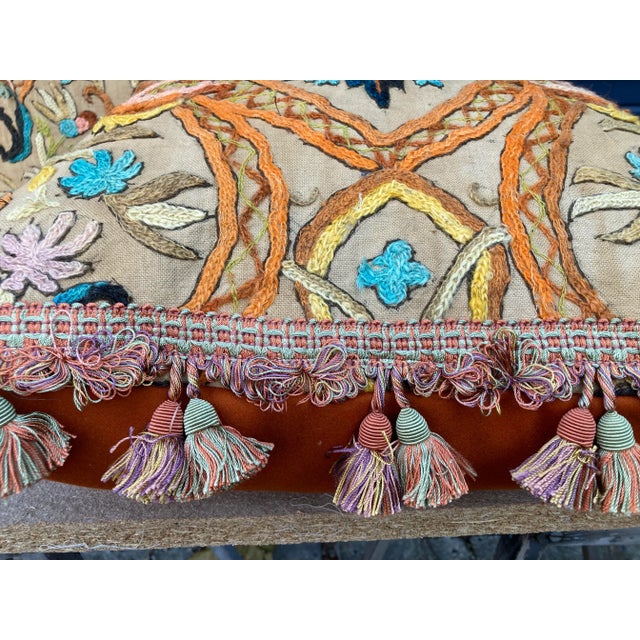 A pair of pillows made from a circa 1920’s hand embroidered crewel work textile, embellished with opulent tassel fringe...