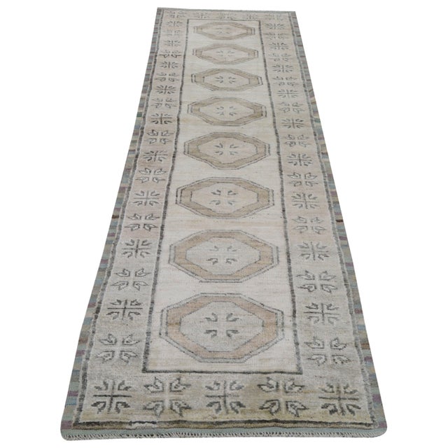 Hand-knotted with care using traditional rug making techniques, this wool rug blends timeless craftsmanship with a modern...