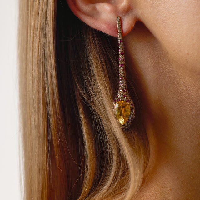 These dramatic vintage drop earrings are a bold and luxurious expression of 1990’s glamour, designed with color, movement,...