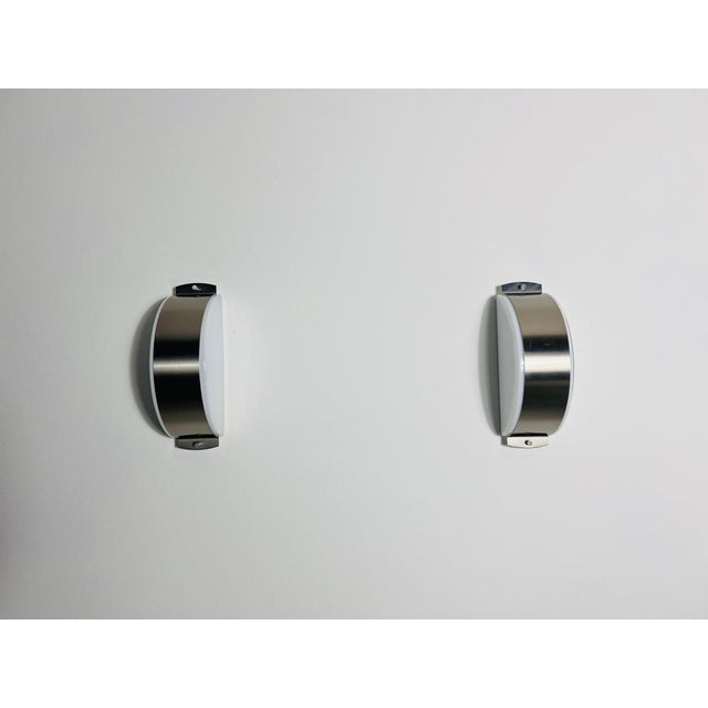 This pair of distinguished limburg wall lamps, crafted in the 1960s, exemplifies the superior quality and precision of...