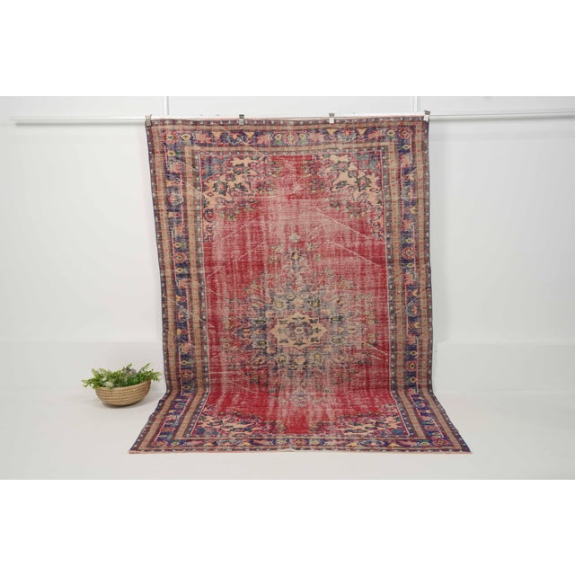 Vintage Hand-Knotted runner rug is a semi-antique vintage area rug. The '70s Eastern region of Anatolia's unique rug is...