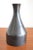 Scandinavian copper vase in the style of Herbert Krenchel or Krenit. The vase is black outside and the inner surface...