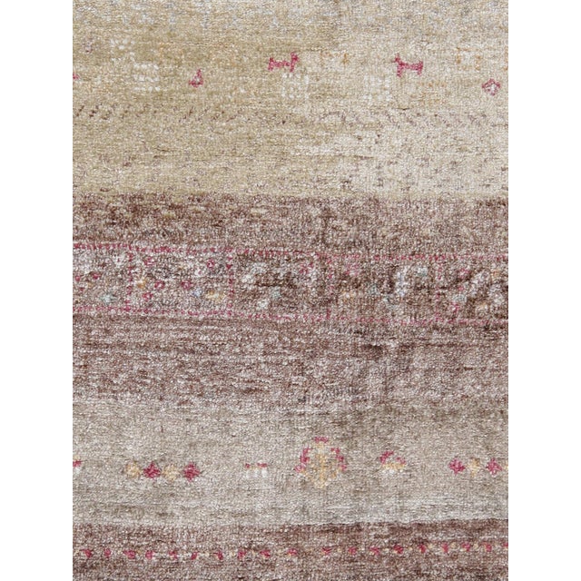 Tribal Hand-Knotted Area Rug is handmade with extra high pile and very simple, stylized designs. They are constructed from...