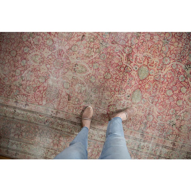 :: Sprawling covered allover field of intricate scrolling arabesques and floral cross sections bearing interior minor...