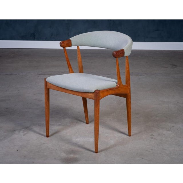 Danish modern teak armchair, Model BA113, designed by architect Johannes Andersen and produced by Brdr. Andersens...