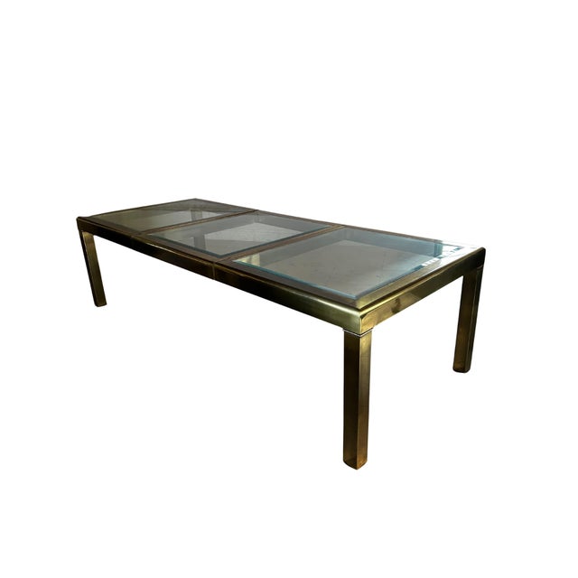 A stunning example of Mastercraft’s celebrated mid-century craftsmanship, this brass and glass extension table combines...