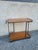 Mid-century bar cart with a metal frame and wooden shelves. Excellent overall condition, with minor signs of wear....