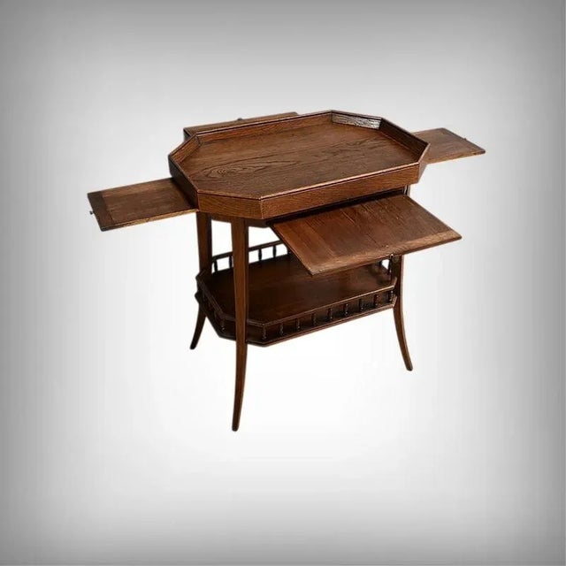 This oak serving table stands out for its sophisticated design and thoughtful functionality: its octagonal top with raised...