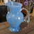 The "WANDA" Hand Blown Blue Art Glass Pitcher is a stunning piece handcrafted in Poland. With its solid blue color and...