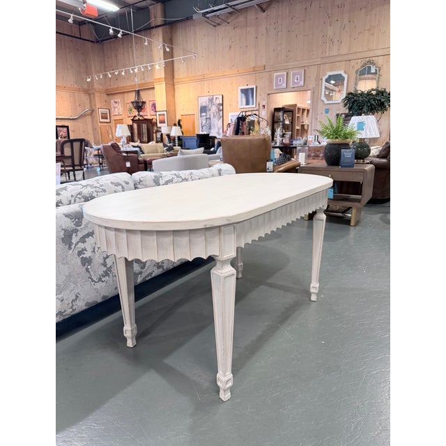 Inspired by the timeless beauty of antique Gustavian furniture, the OKA Rufflen Dining Table offers a graceful balance of...