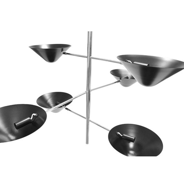New special order item. Not vintage. Three crossed, polished nickel arms balance six matte black uplight shades in air...