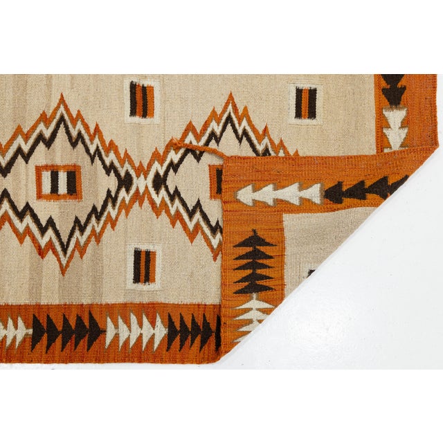 Elevate your interior with this striking hand-woven wool rug, crafted in a contemporary Southwest and Navajo-inspired...