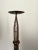 A solid chunky heavyweight french iron pricket candlestick with great patina and a brutalist aesthetic, supported on...
