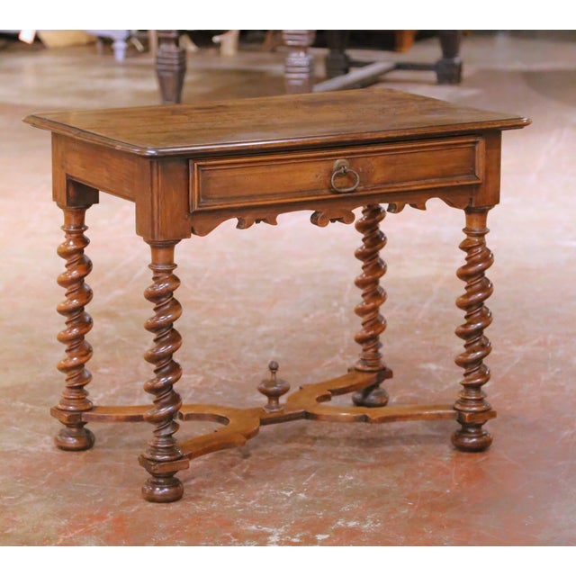 Incorporate elegant, functional surface space into a living room, study, or den with this handsome antique French walnut...