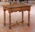 Incorporate elegant, functional surface space into a living room, study, or den with this handsome antique French walnut...
