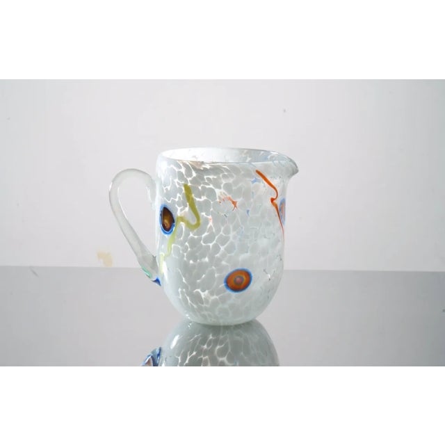 Stupendous set of Murano glass, a tribute to Mirò. Designed by Mariana Iskra, complete with Caraf. Signed by Maker